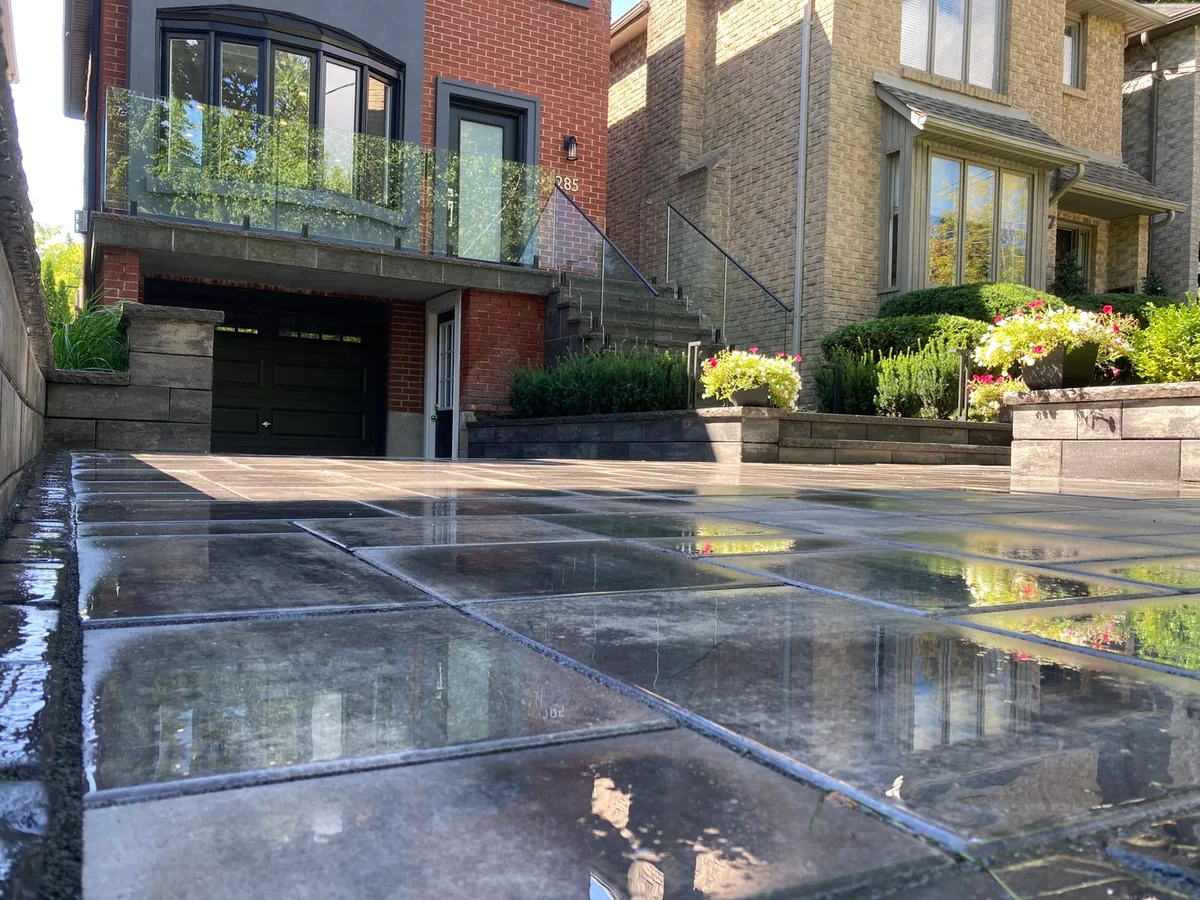 Another low-angle reflection shot of the paver driveway.