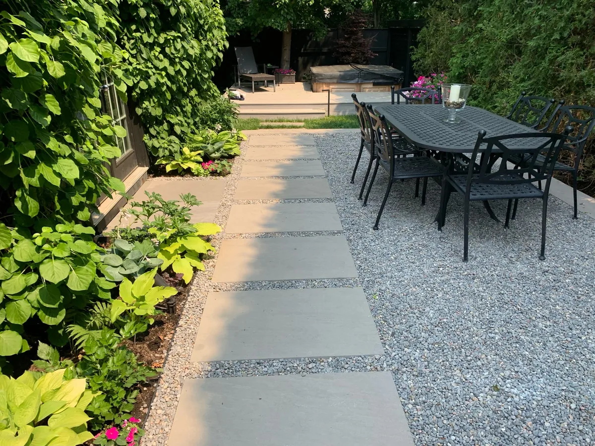 A similar view of the backyard patio and garden area.
